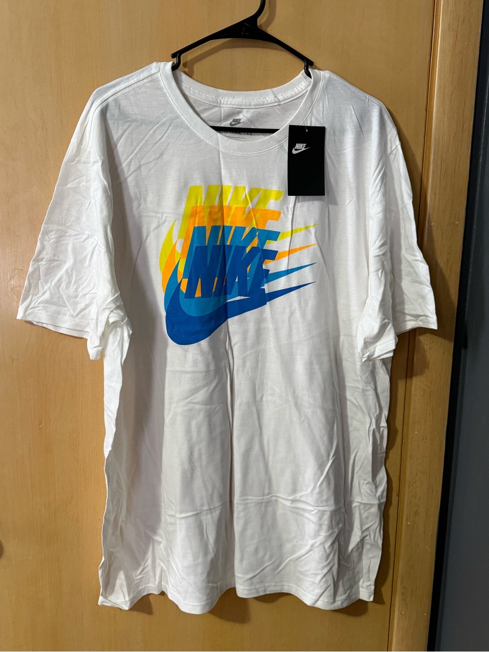 Nike White Short-Sleeve Tee with Blue & Yellow Swoosh Graphic